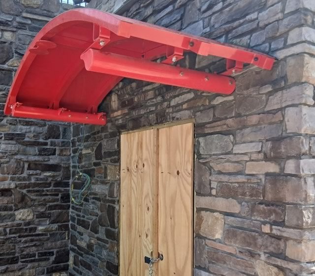Stonework around the canopied entrance